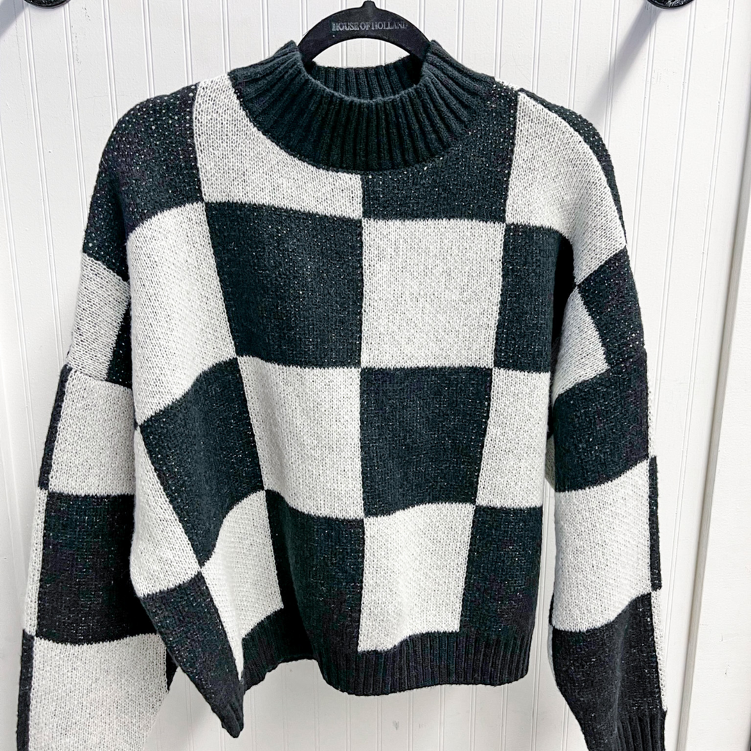 Cozy Weekend Plans Checkered Sweater, large black and white squares with a mock neck that is ribber sweater. 