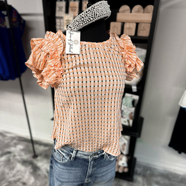 Simply sweet checkered mango top, with ruffle sleeves.