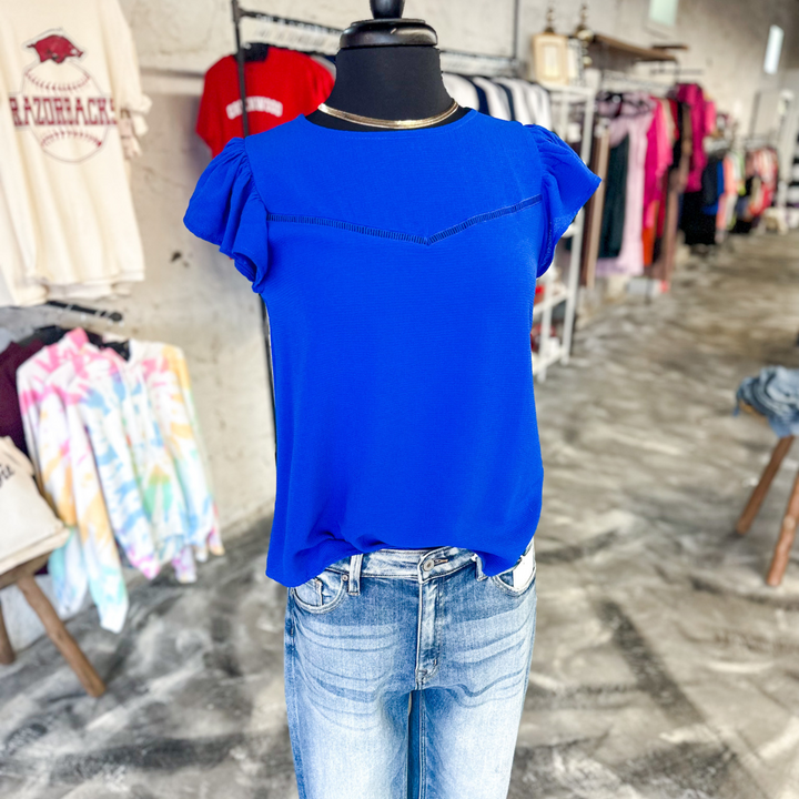 Royal Blue causal Top, pairs well with jean shorts or jeans for the cooler spring days, women's top, small detail close to neckline with fabric, ruffle sleeve.