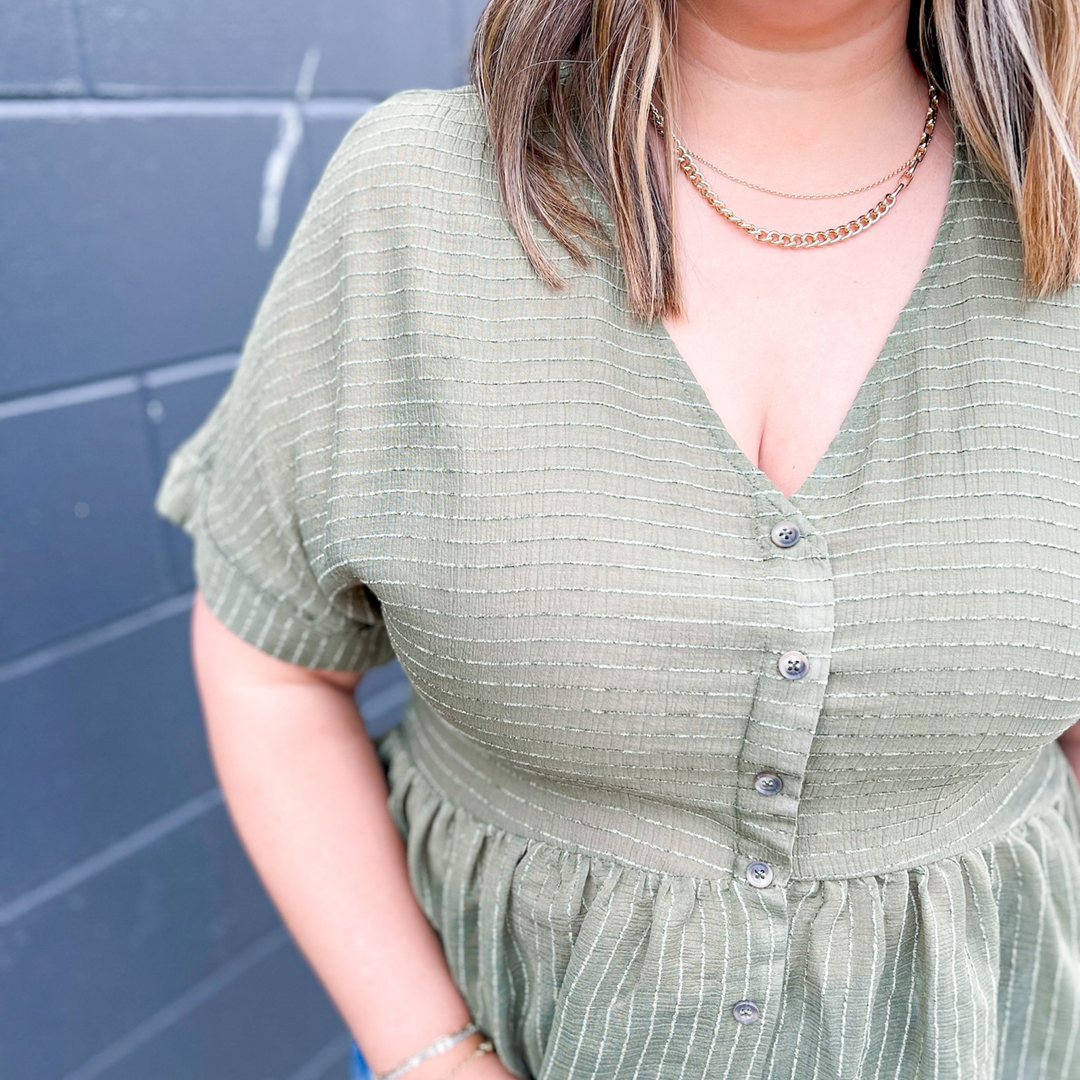Whisk Me Away Olive Babydoll Top, olive green with a pin stripe textured detail. button up front, v-neck neckline. 