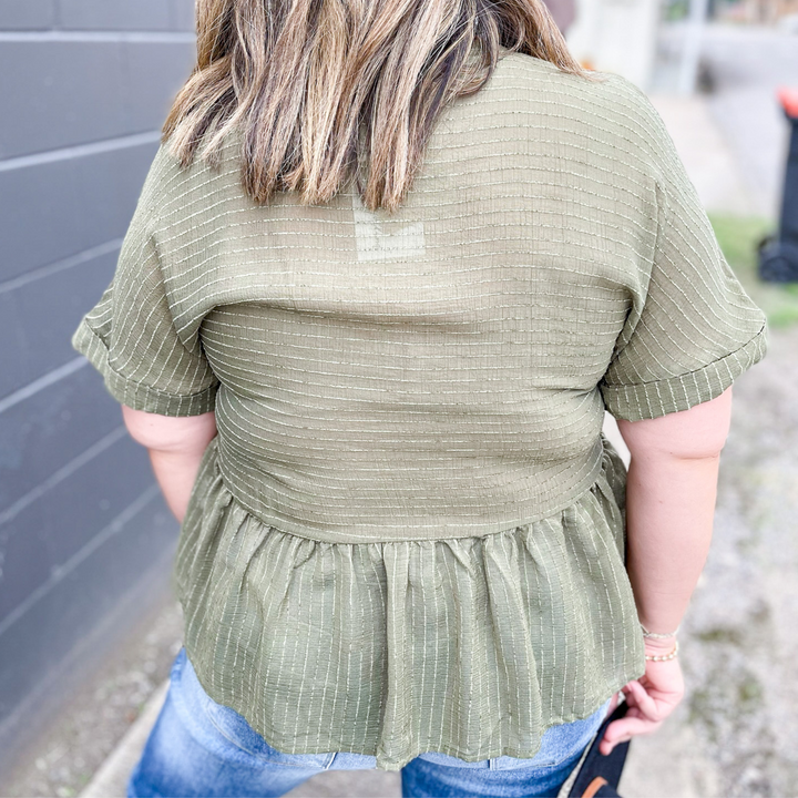 Whisk Me Away Olive Babydoll Top, olive green with a pin stripe textured detail. button up front, v-neck neckline. 