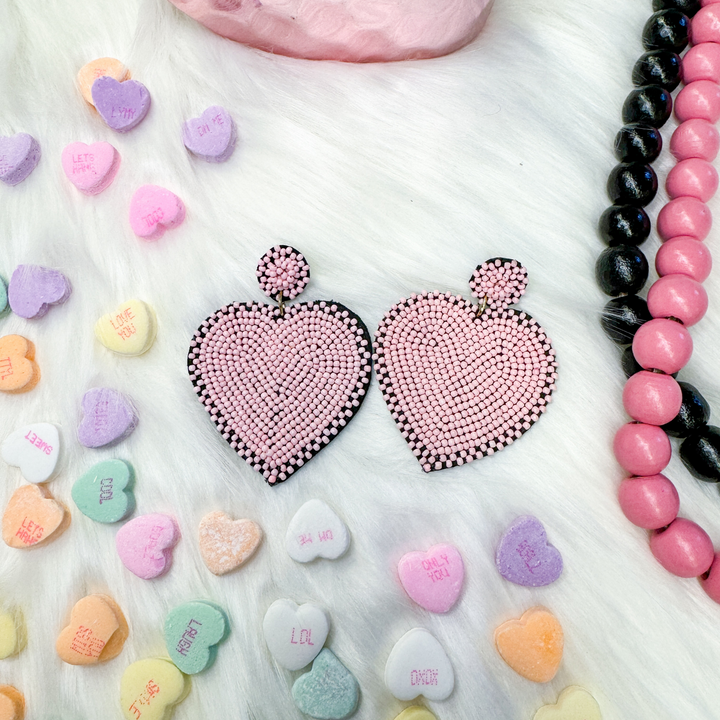 valentine's day beaded earrings, light baby pink colored heart with a black outline