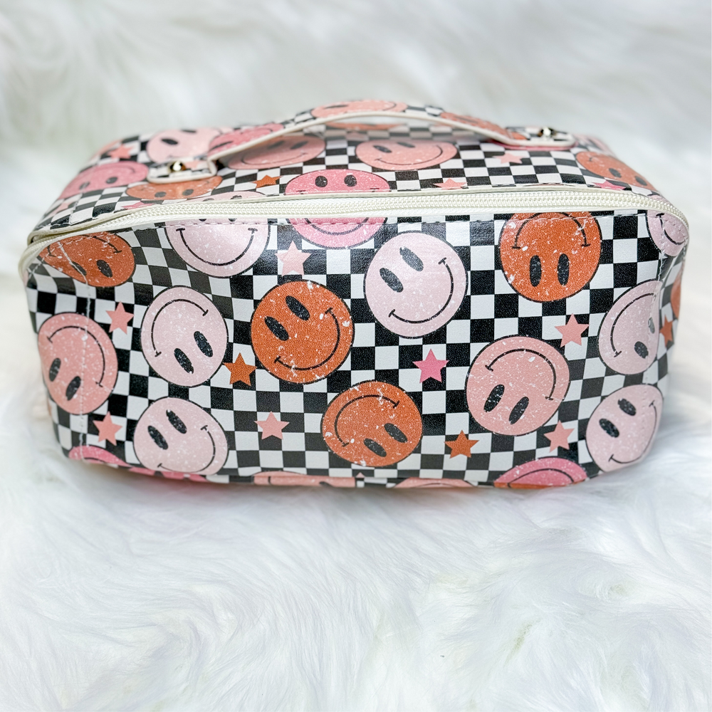 expandable multi-functional makeup bag with checkered background and many red and pink smiley faces
