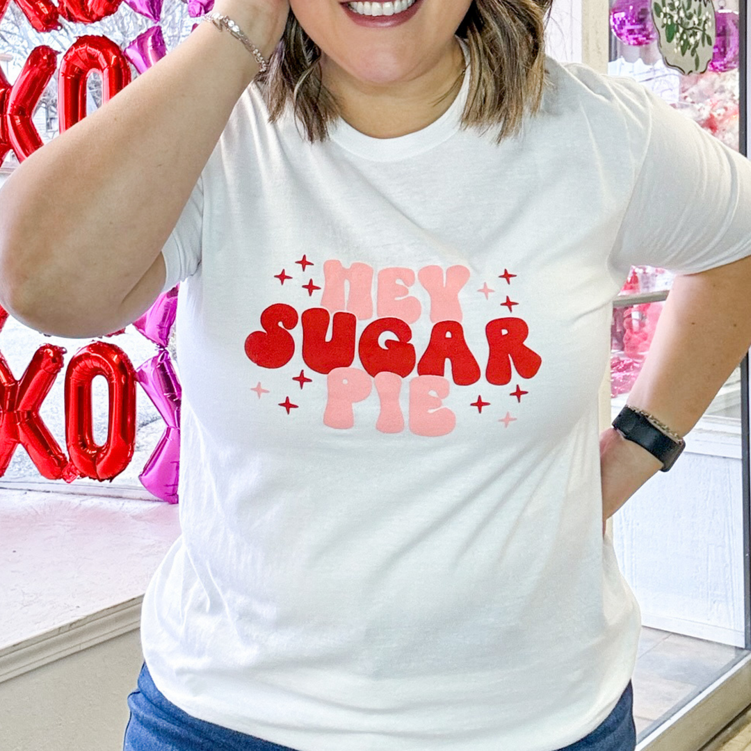 valentine's graphic white t-shirt that says "hey sugar pie" in pink and red bubble font lettering