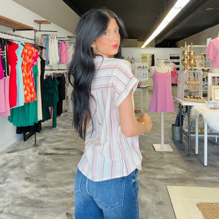 Real Fling Striped Woven Top! Featuring a vibrant mix of complementary stripes, plus a back button-down detail that's sure to be the cherry on top of your look.