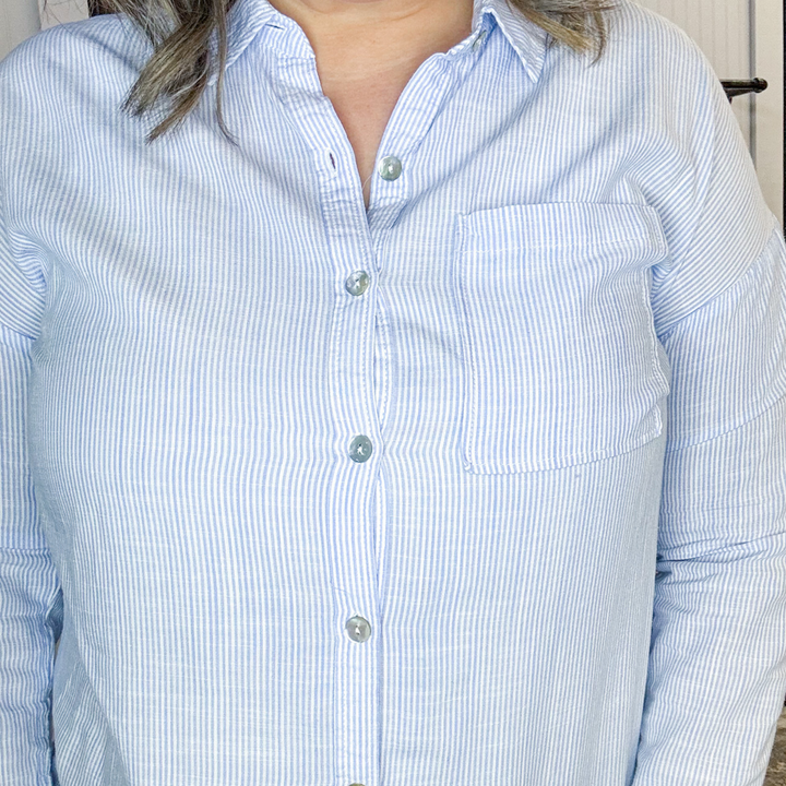 blue and white pin stripe button down shirt.