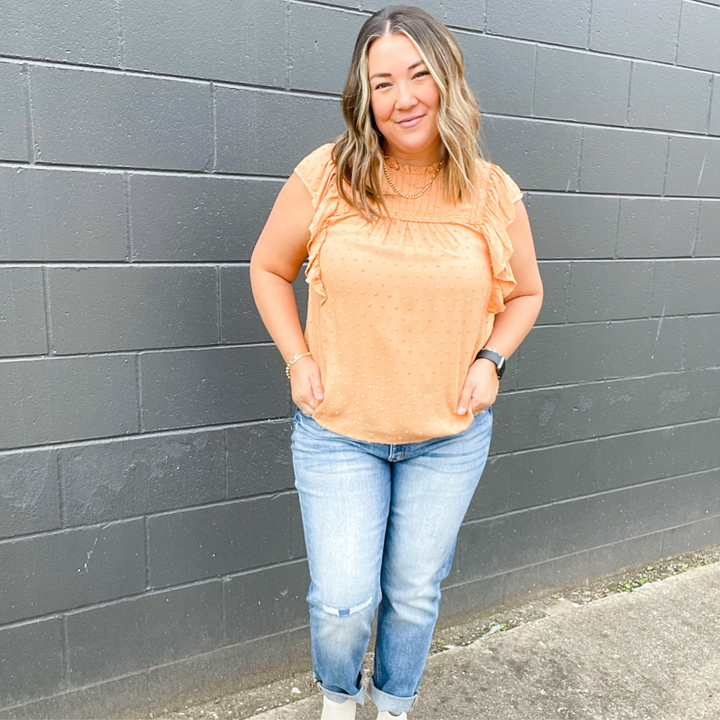 Serene Dreams Dusty Orange Top, sweet dusty orange top with small swiss dot detail, neckline ruffles, pleated type sleeves and other neckline details with trimmed fabric detail.