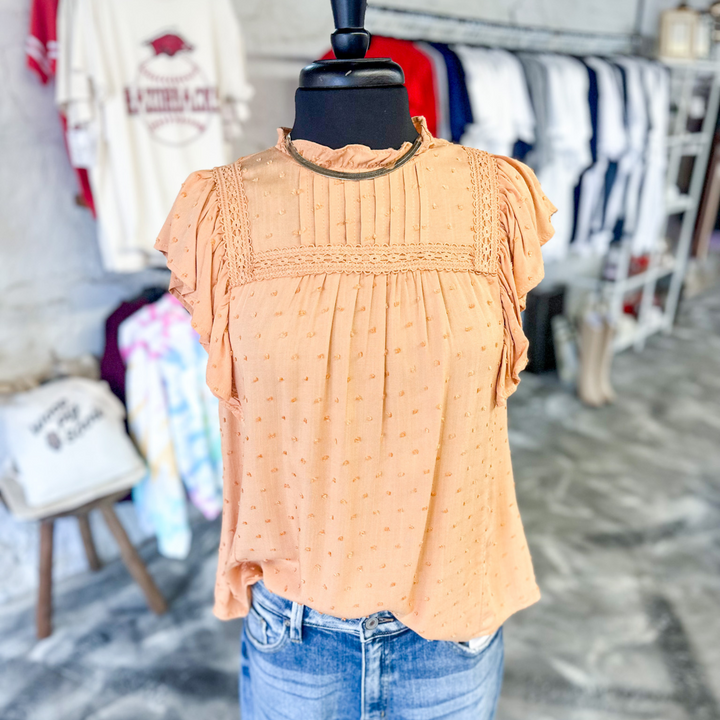 Serene Dreams Dusty Orange Top, sweet dusty orange top with small swiss dot detail, neckline ruffles, pleated type sleeves and other neckline details with trimmed fabric detail.