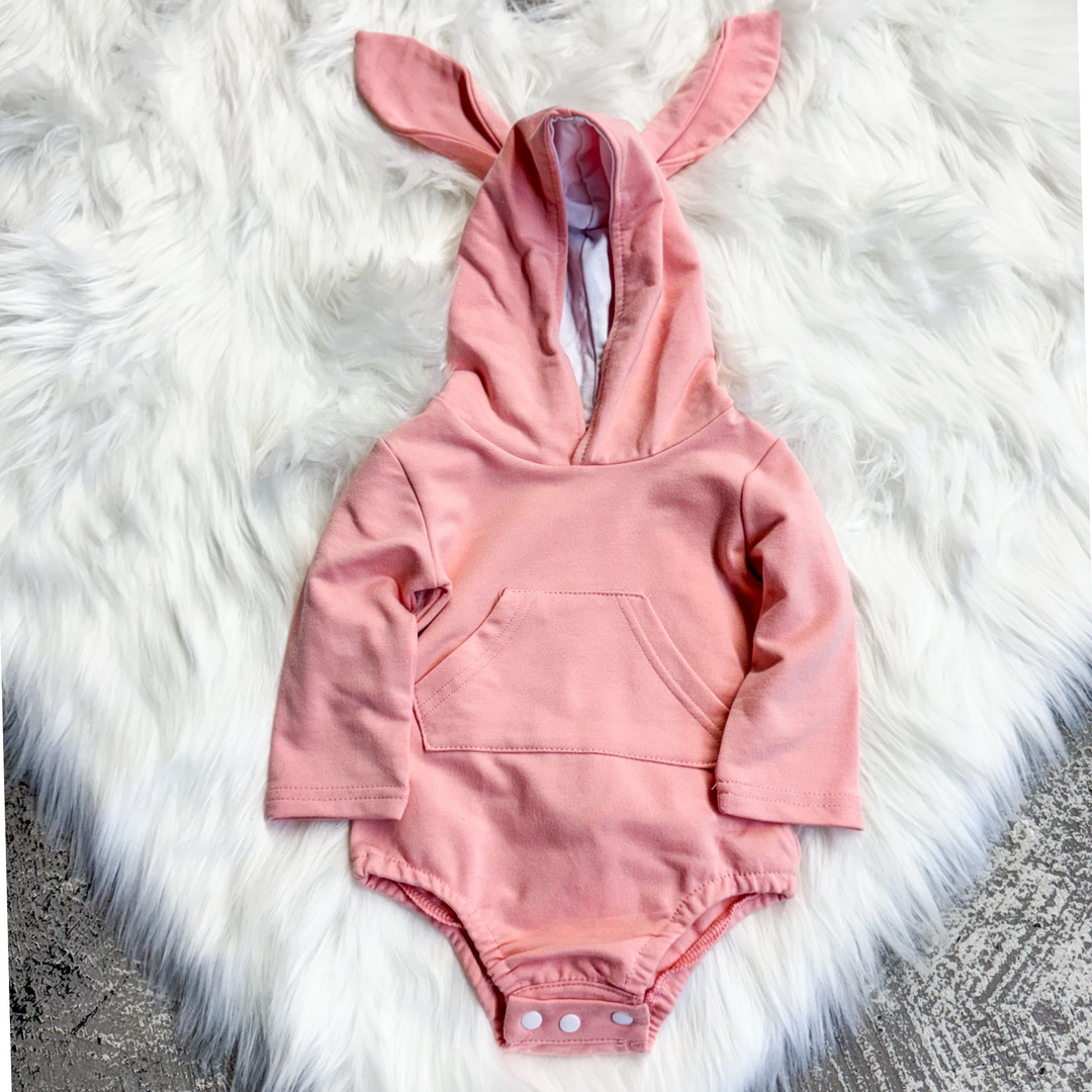 easter kids outfit, pink bunny onesie, hood has bunny ears, bunny cotton tale, front hoodie pocket, snap closure. 