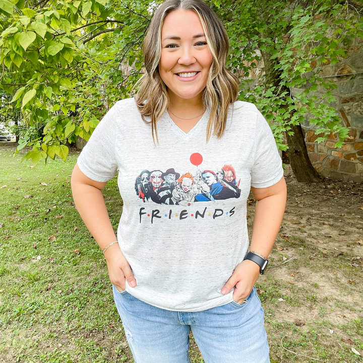 friends halloween graphic tee, heathered grey with a slight v-neck, halloween bad guy characters with the word friends under neath in the show friends font.