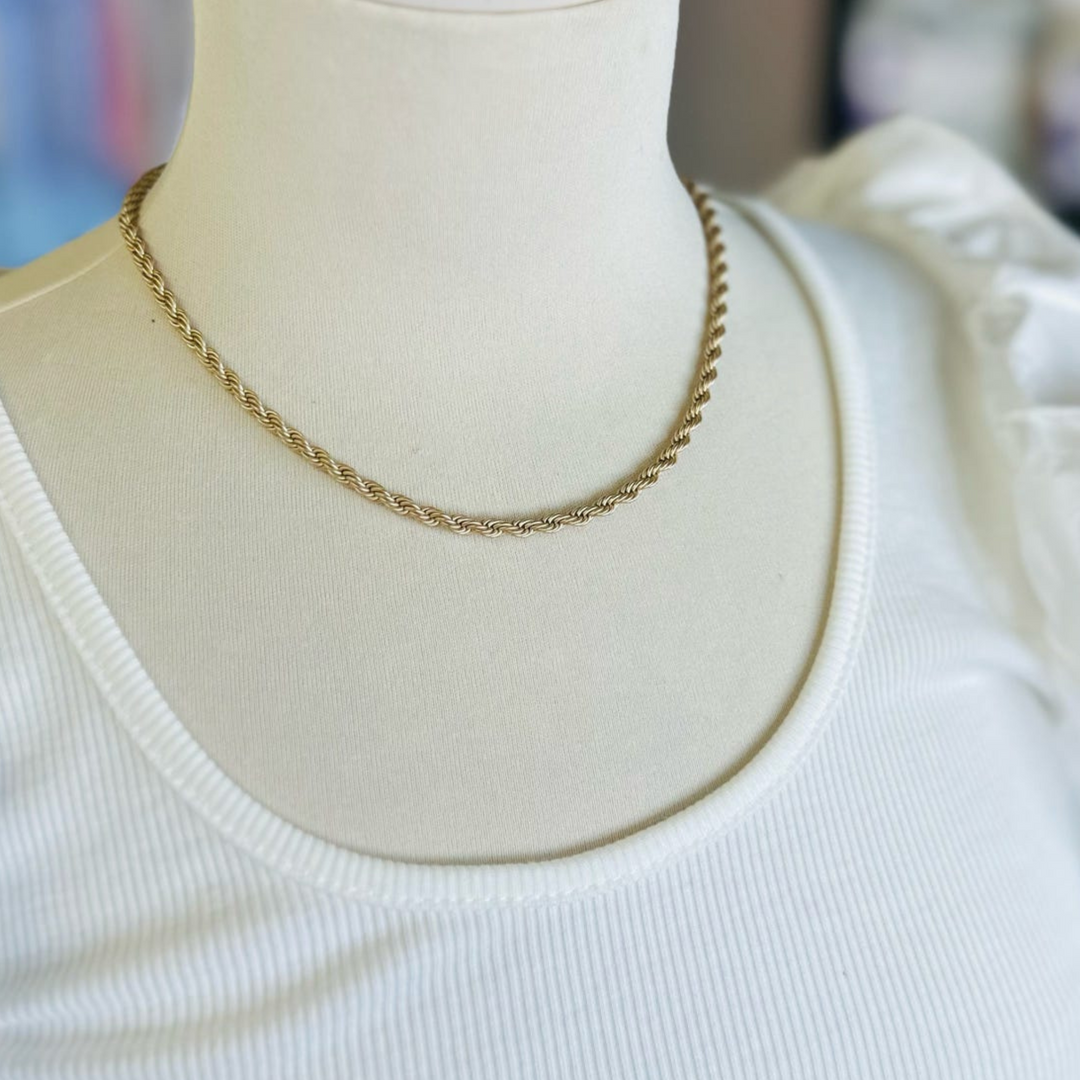 Gold rope chain necklace.