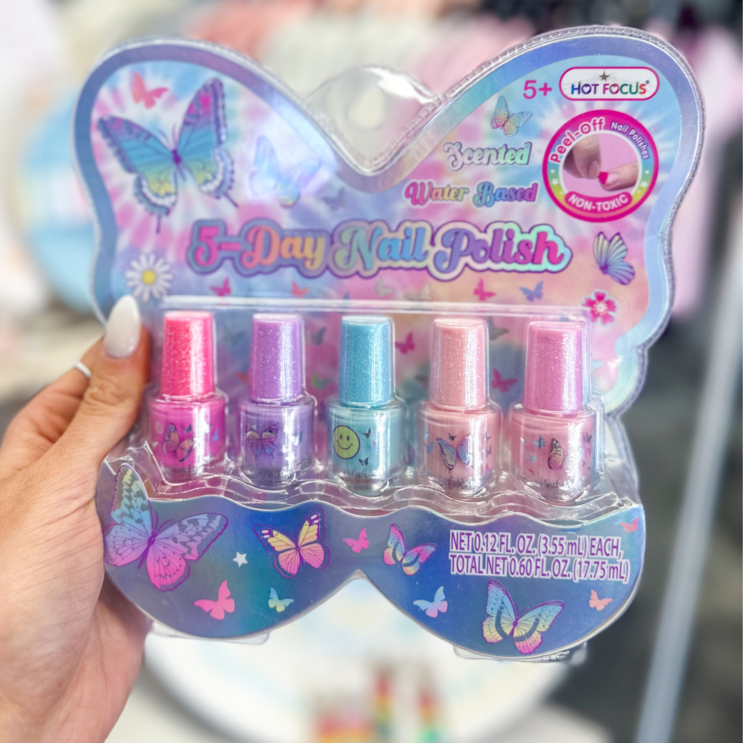 kid's gift, 5 day nail polish kit, hot pink, purple, blue, light pink, medium pink, scented, water based, bottles have a cute design with butterflies and smiley faces, packaging in the shape of a butterfly, bright colors and glitter. 