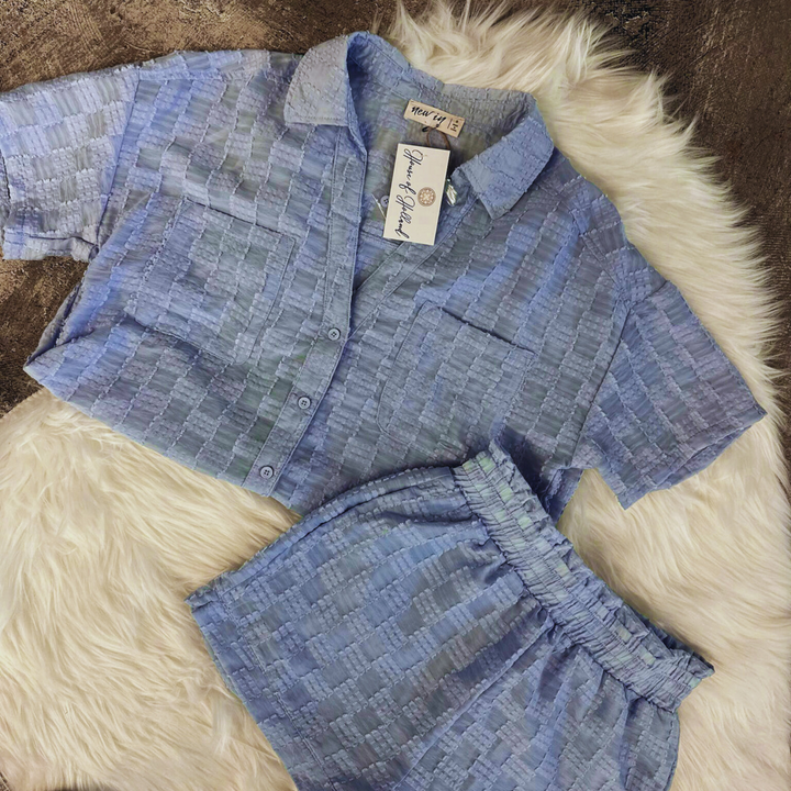 Lavender blue checkered set, light weight set, shorts and short sleeve button up top. two pockets on bust area.