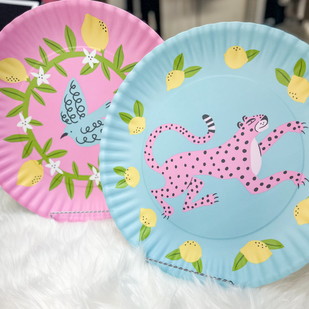 Fun platter, pink leopard with blue background, blue bird with pink background, lemons and greenery around animals