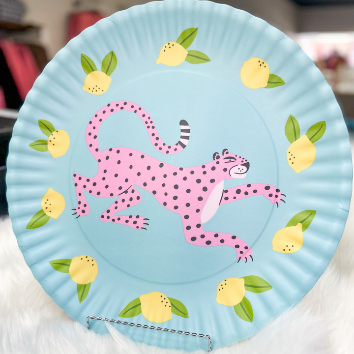 Fun platter, pink leopard with blue background, blue bird with pink background, lemons and greenery around animals