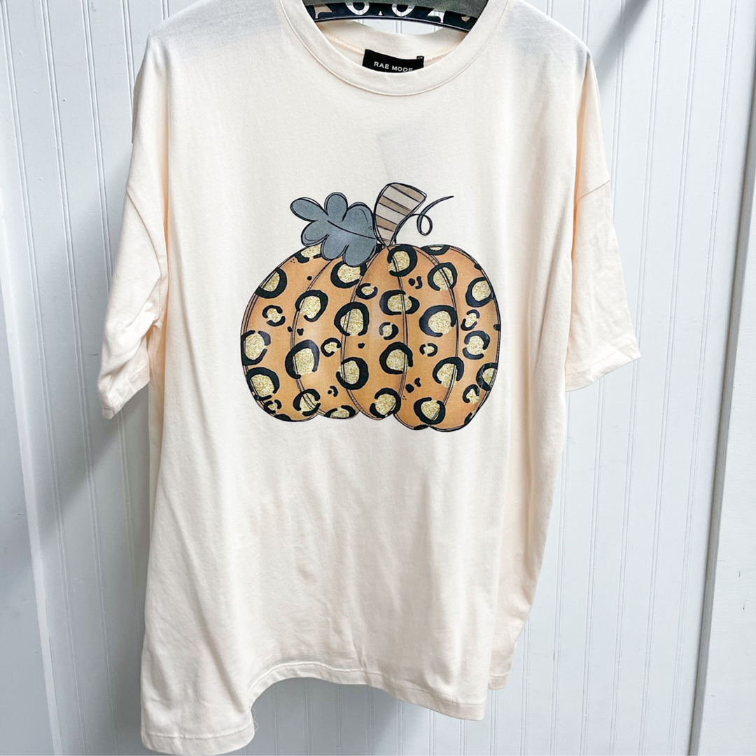 leopard pumpkin fall tee, cream colored shirt with light orange whimsical pumpkin with leopard print. 