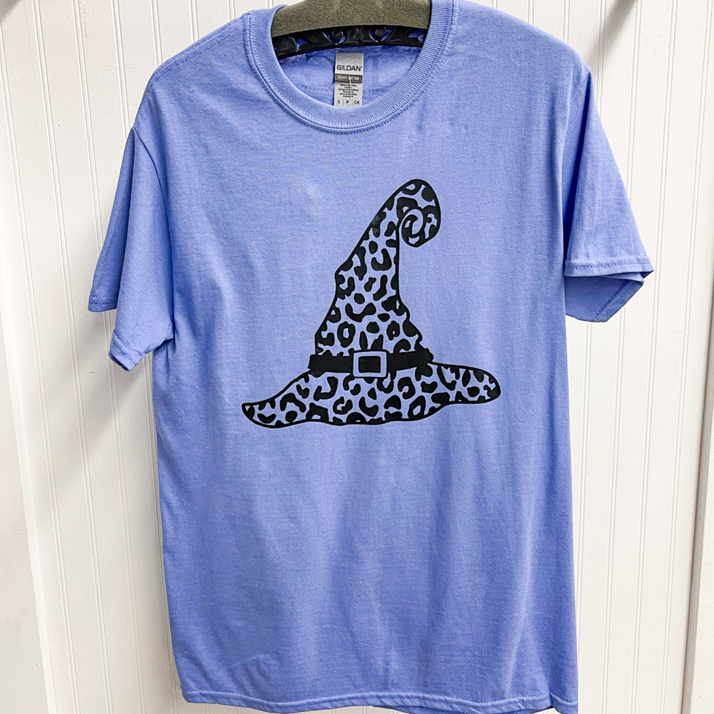 halloween graphic tee, purple round neck shirt with a witches hat in black leopard print.