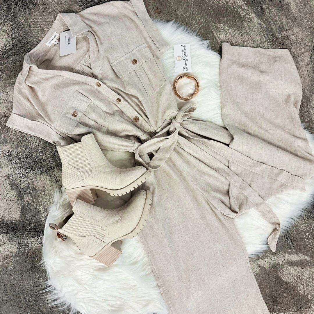 oatmeal jumpsuit, wrap around tie belt, button up on top part, short sleeve, pant, two button pockets on bust area.