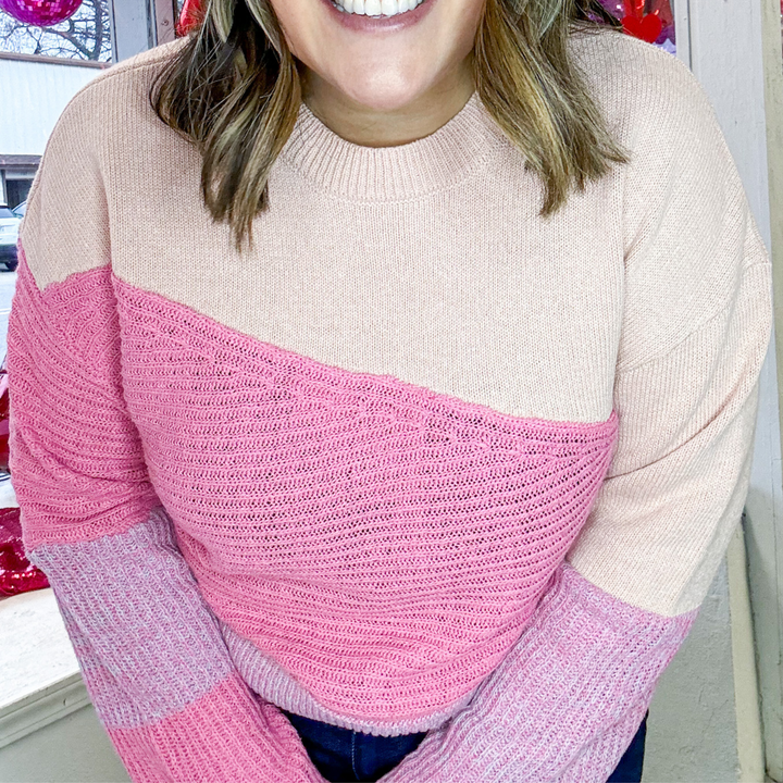 different shades of pink and cream color block textured sweater