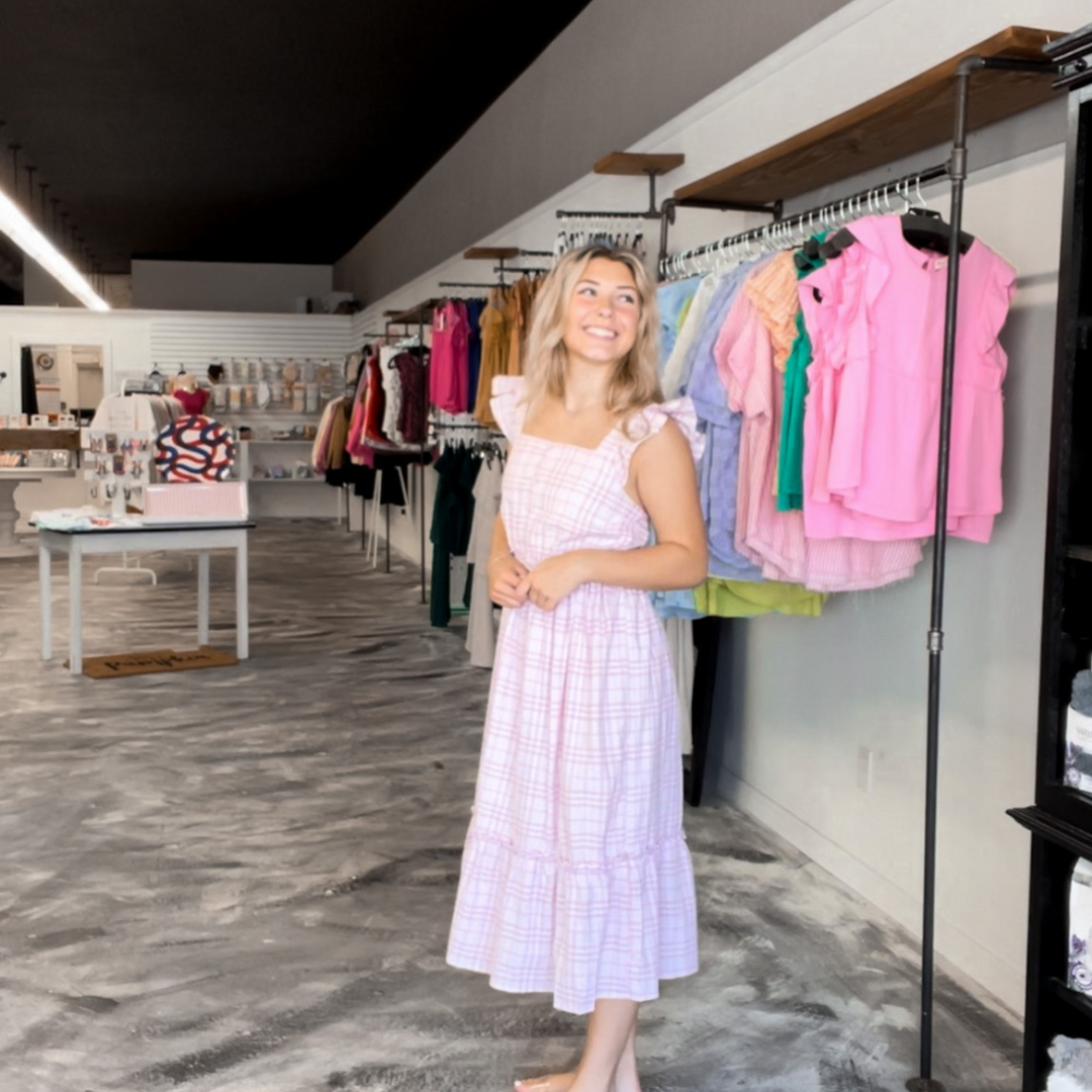 soft light pink plaid printed midi dress with ruffle cap sleeves.