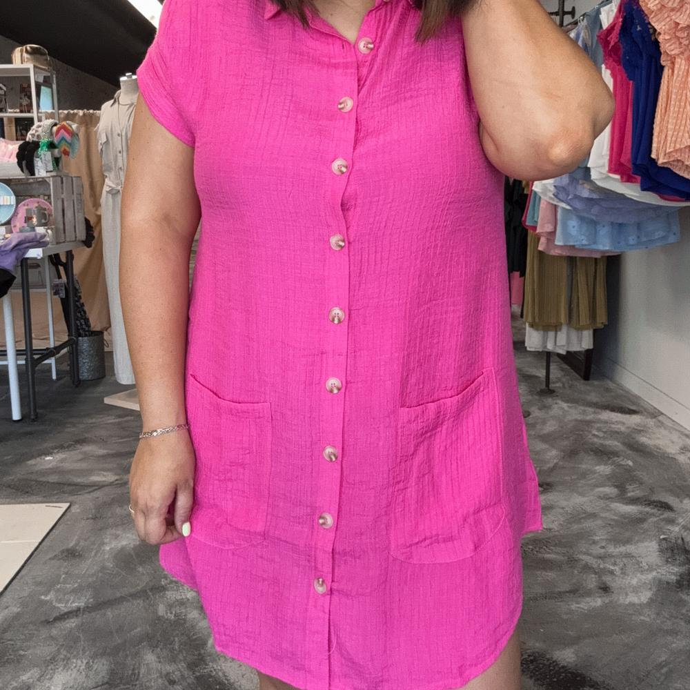 pink tunic dress, button down front detail with pockets, collar, cuff sleeves.
