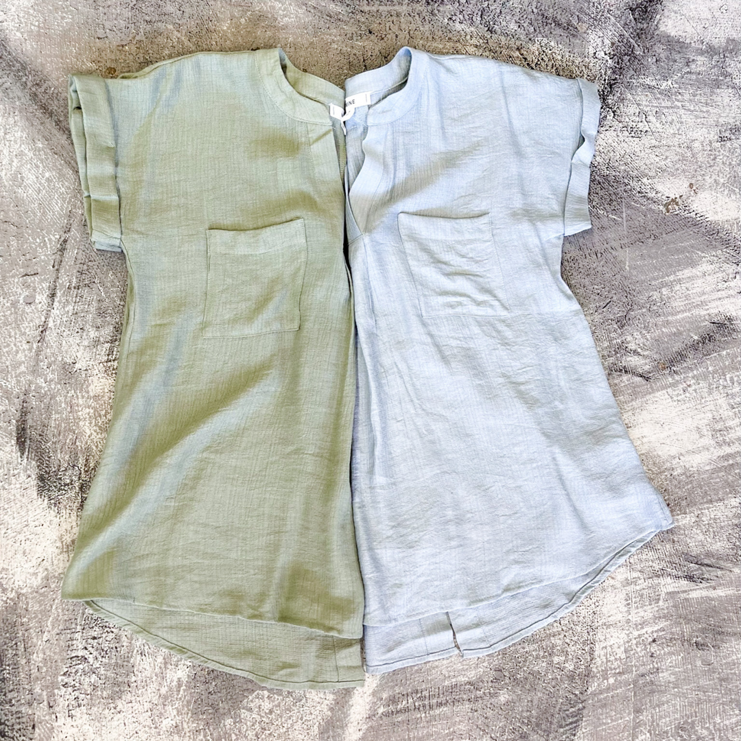 Easy To Style Sage Woven Top, woven women's short sleeve top with v-neck with detail. double front pocket detail. back button detail going down the center. 