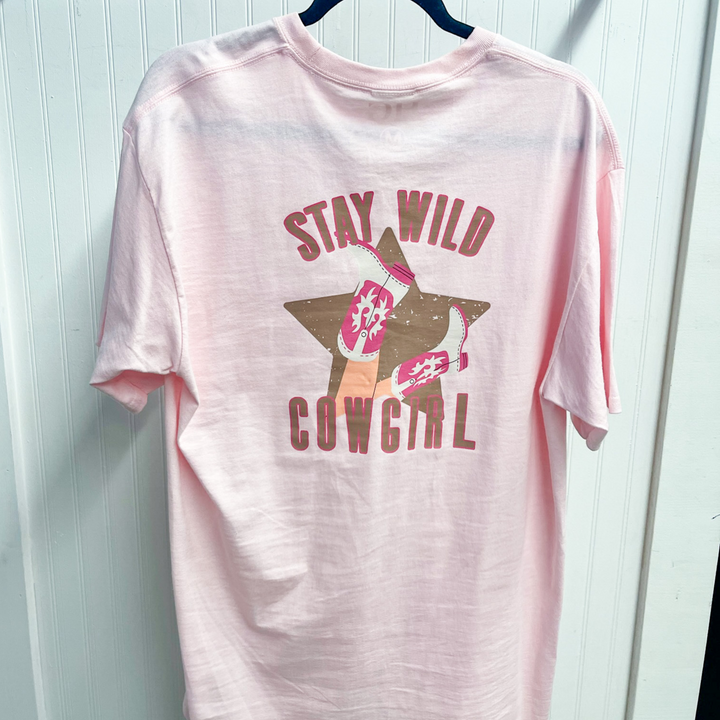 pink graphic tee that says stay wild cowgirl on the back in brown, pink with a brown star and cowgirl boots. 