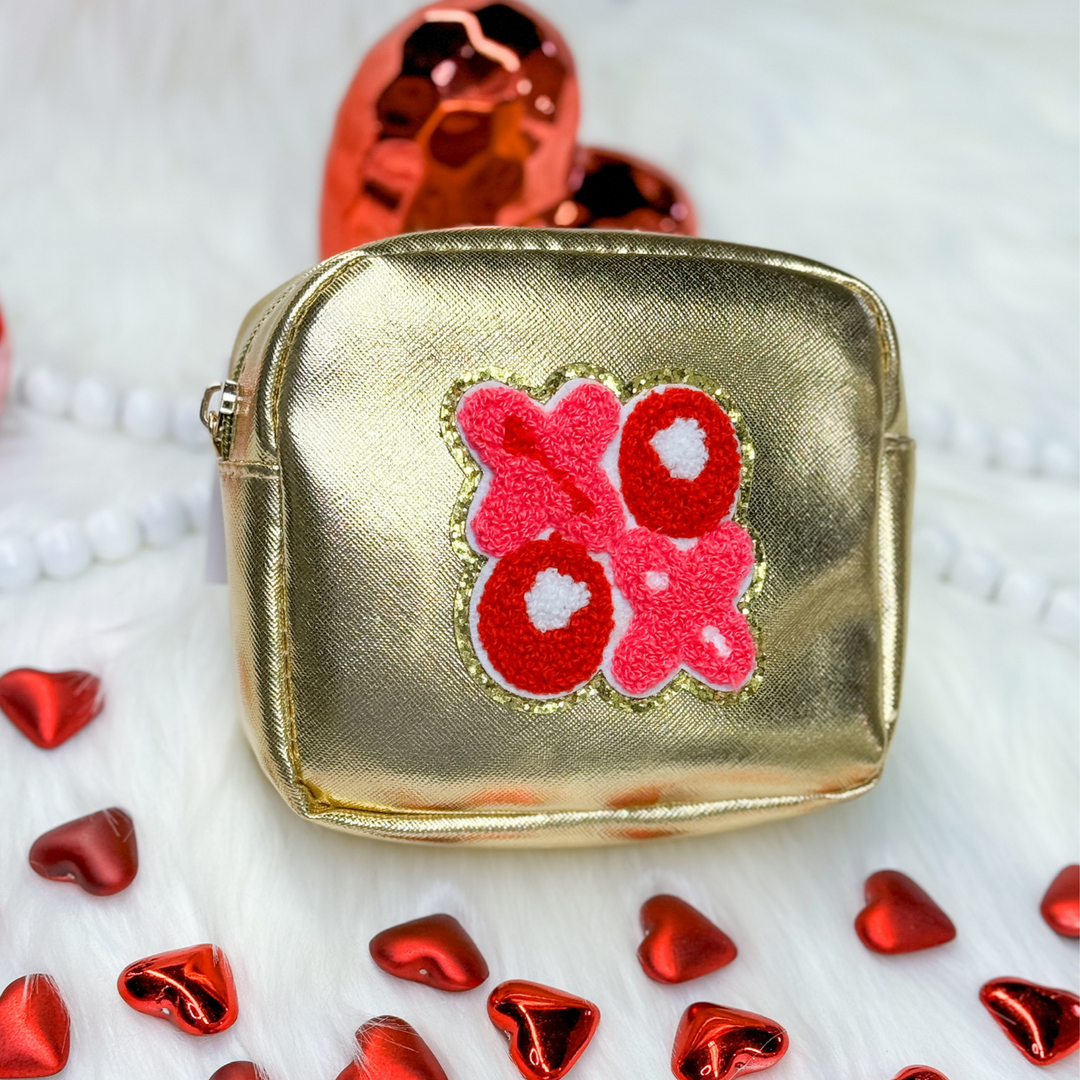 valentine's day gift, gold metallic bag with a red and pink xoxo chenille patch. 