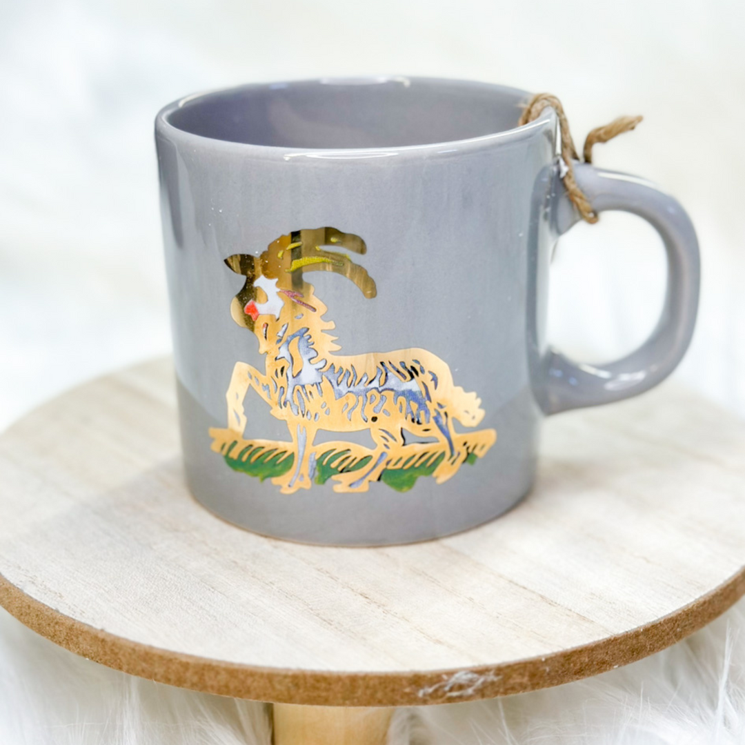 coffee cups, all 12 zodiac signs, different designs representing each zodiac sign, some animals, some vibrant colors on certain cups 