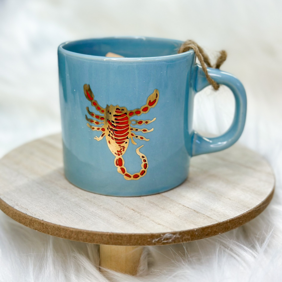 coffee cups, all 12 zodiac signs, different designs representing each zodiac sign, some animals, some vibrant colors on certain cups 