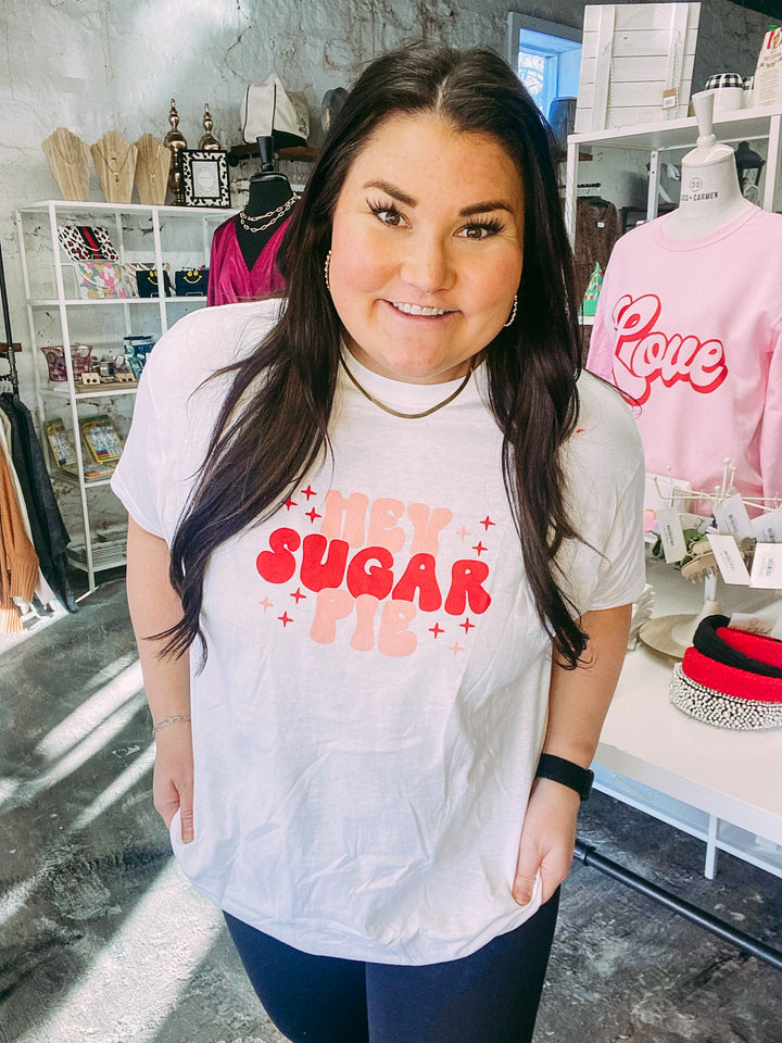 valentine's graphic white t-shirt that says "hey sugar pie" in pink and red bubble font lettering